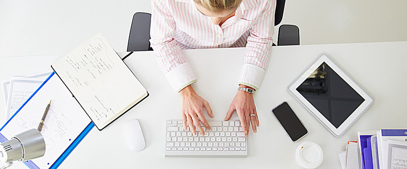 Team member working on a laptop at a desk